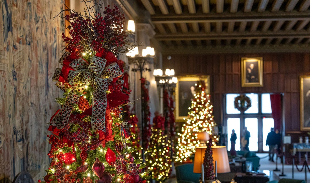 Bows atop Christmas trees in the Tapestry Gallery
