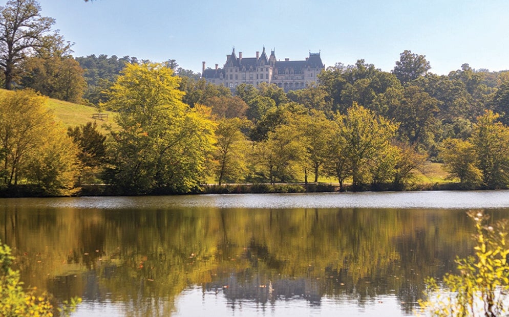 Early color can usually be seen around the Lagoon, from which you can also enjoy this view of the back of Biltmore House.