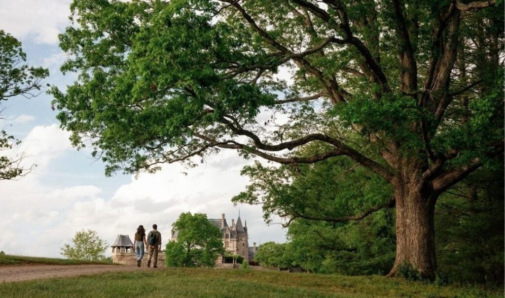 A couple on a trail behind Biltmore House