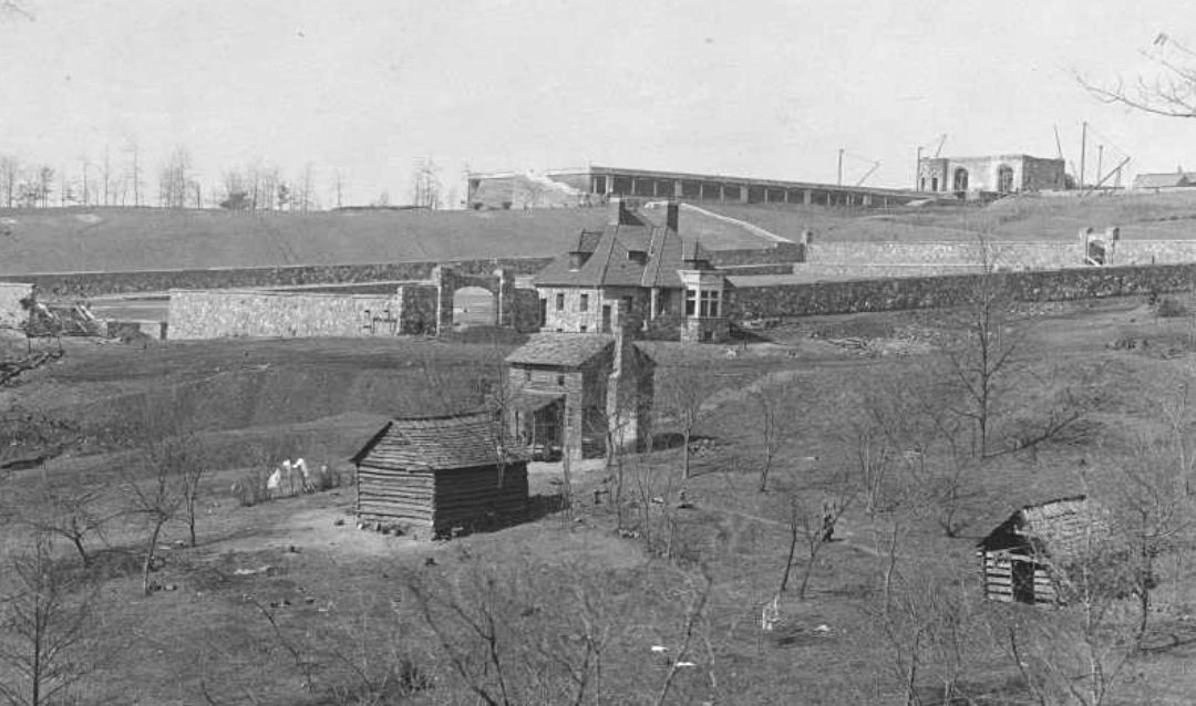 This photo taken February 25, 1893, shows progress on Biltmore House and the Walled Garden. The new structures contrast with the residence of the Wright family in the foreground, which was purchased by Vanderbilt in June 1888.