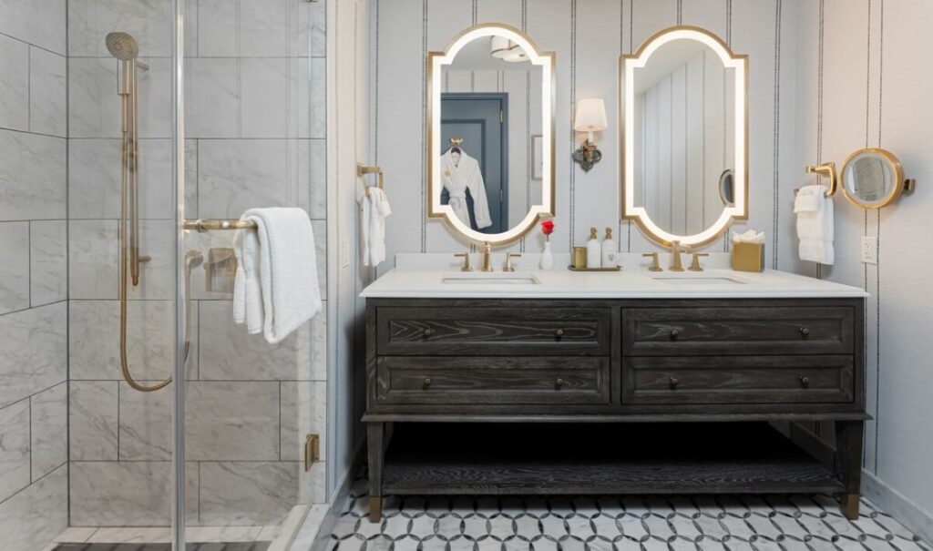 Elegant bathroom with double vanity in a Premiere King Room at The Inn on Biltmore Estate.