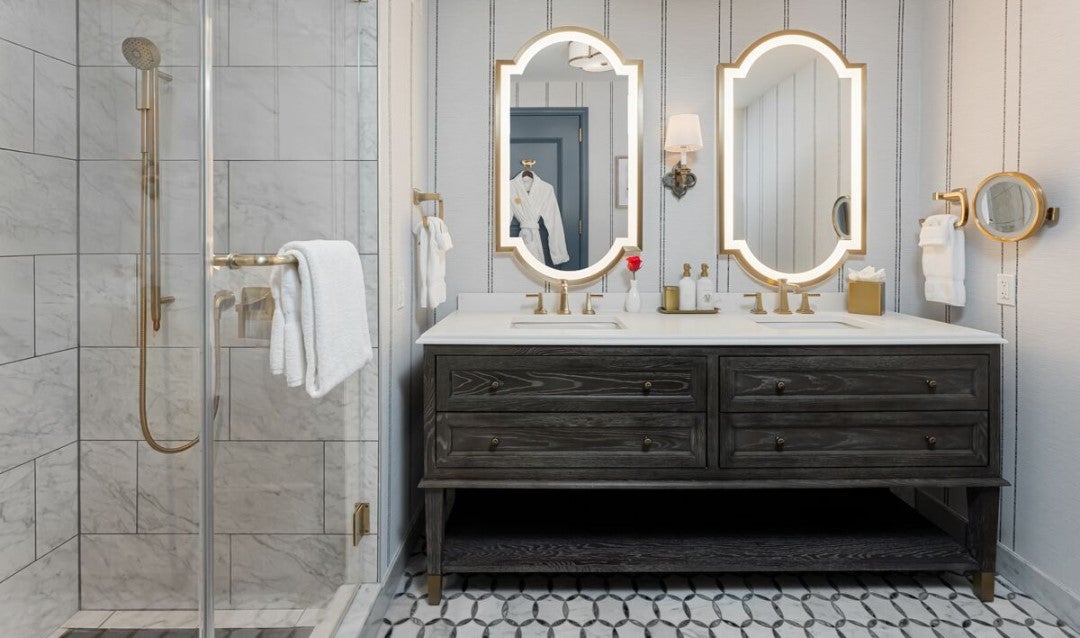 Elegant bathroom with double vanity in a Premiere King Room at The Inn on Biltmore Estate.