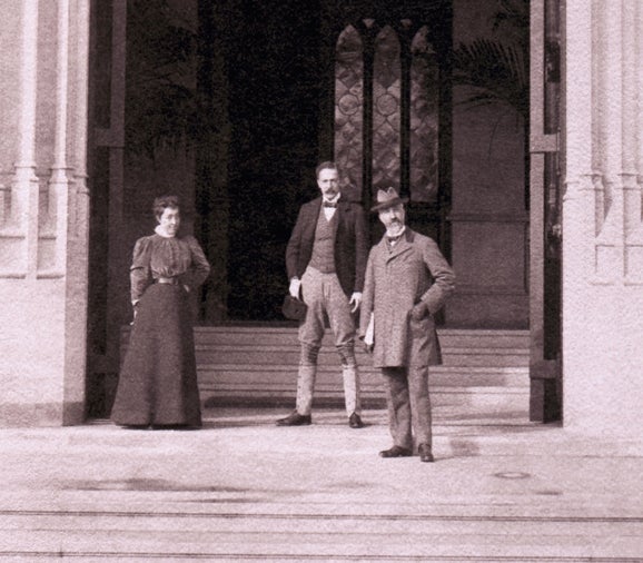Charles McNamee (a white man) posed wearing a grey suit. He has a pointed grey goatee.