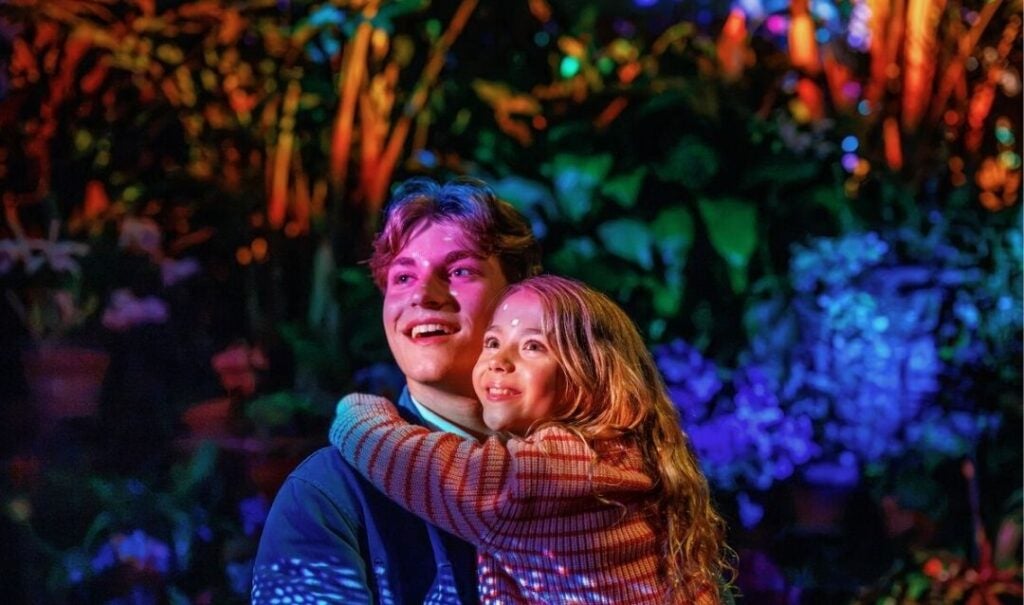 Father and daughter experiencing Luminere in Biltmore's Conservatory