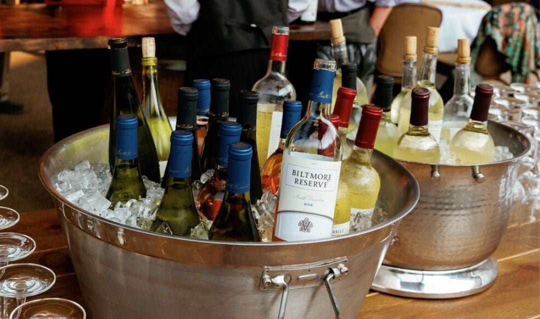 Bitmore wines cooling in buckets filled with ice.