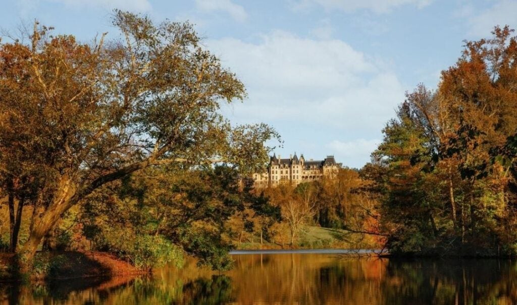 Lagoon view of Biltmore House during fall