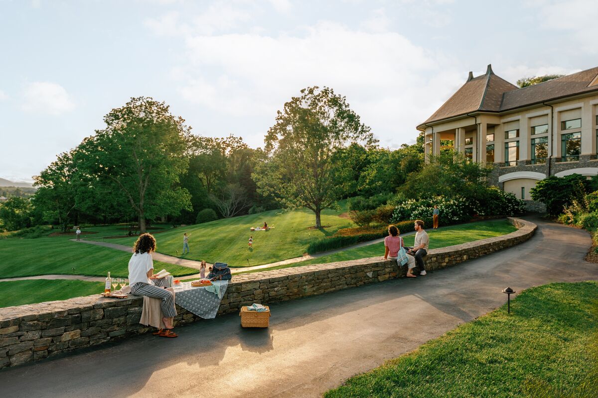 Woman enjoying a picnic on the grounds of The Inn on Biltmore Estate.