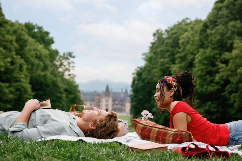 Couple enjoying a picnic with Biltmore House in the background