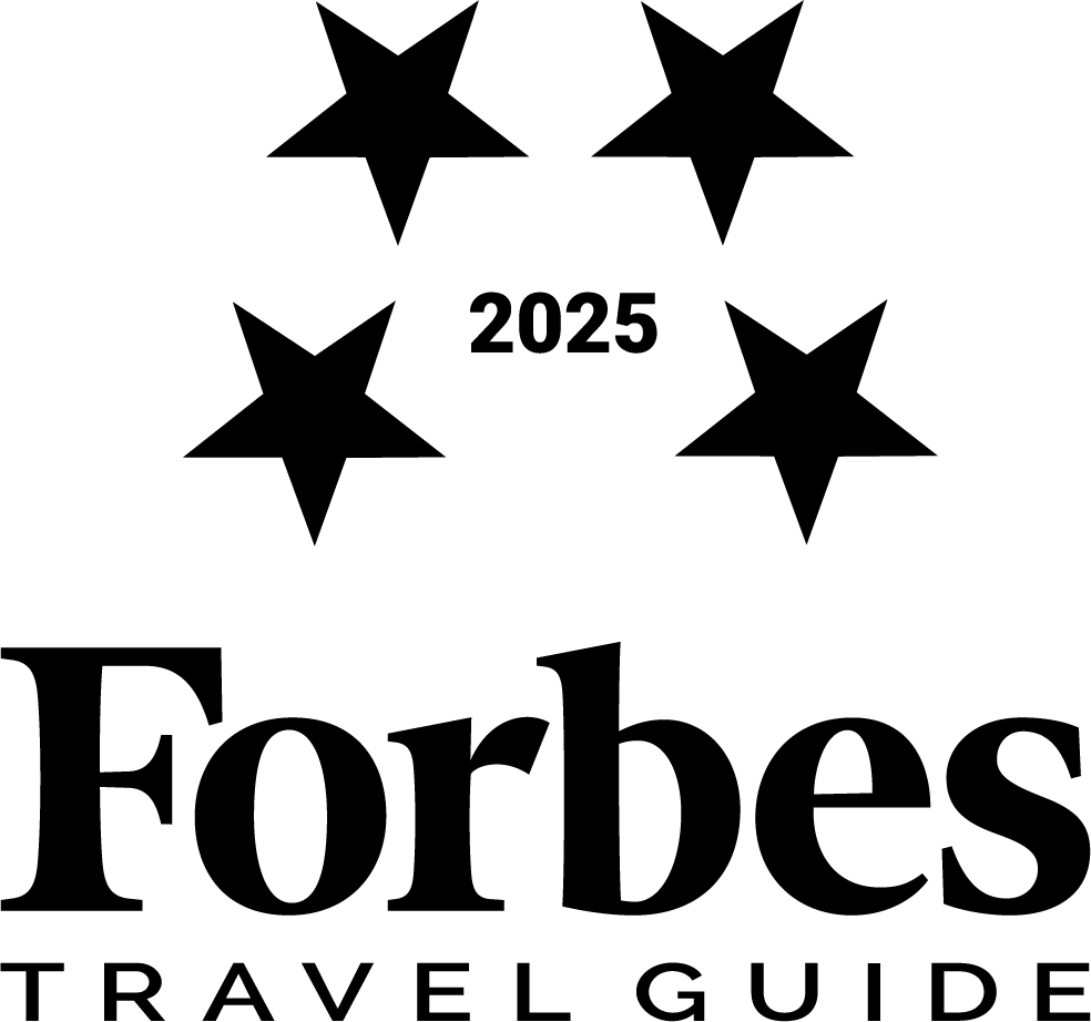 A 2025 four-star badge from Forbes Travel Guide.