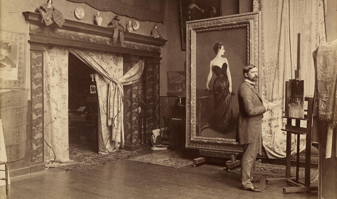 Archival photograph of John Singer Sargent in his studio with the portrait of Madame X.