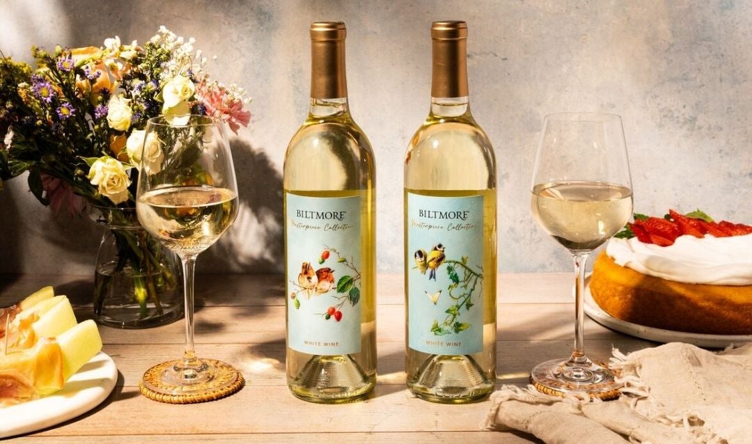 Two bottles of Biltmore Masterpiece Collection White Wine with birds on the labels.