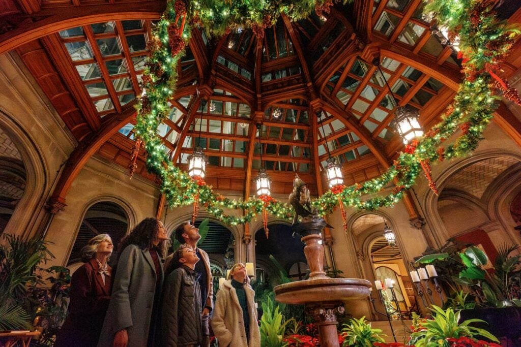 Family enjoys Christmas at Biltmore in the Winter Garden of Biltmore House