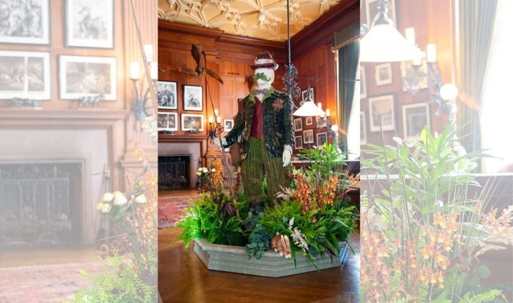 This floral figure represents a gentleman dressed for the outdoors.