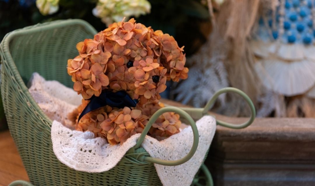 Botanical puppy made out of hydrangeas and other materials.