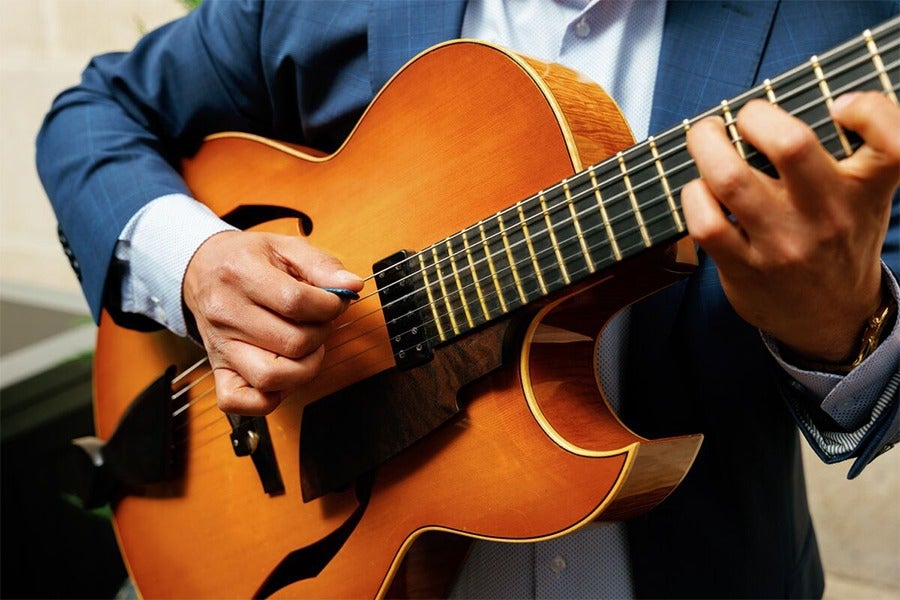 man playing a guitar