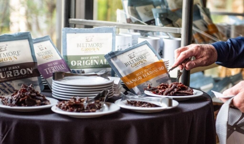 A Passholder samples Biltmore Grown jerky.