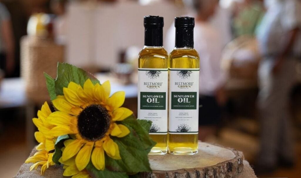 two bottles of Biltmore Grown Sunflower Oil with a sunflower