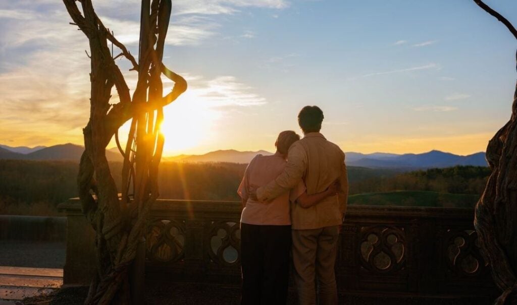 Couple watching the sunset from the Library Terrace of Biltmore House.