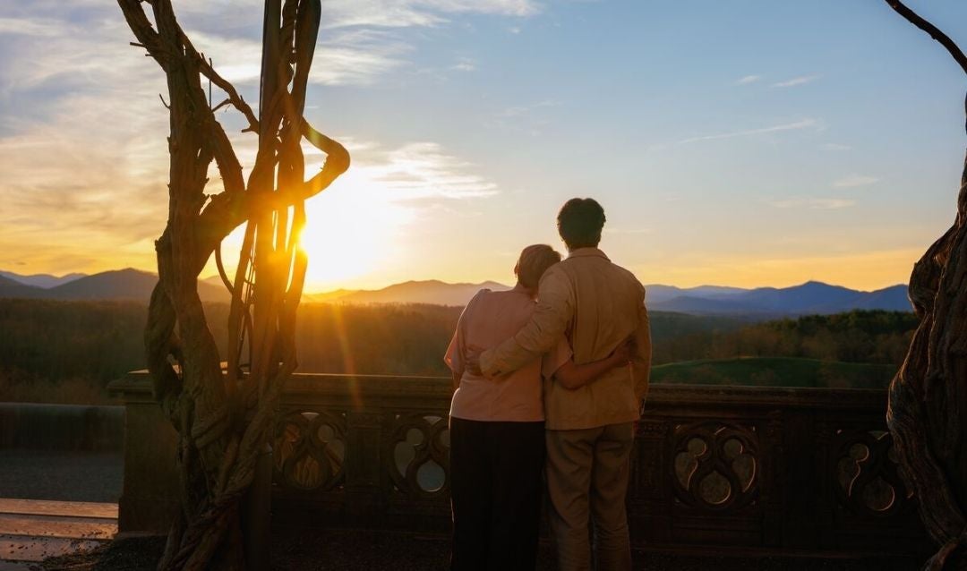 Couple watching the sunset from the Library Terrace of Biltmore House.