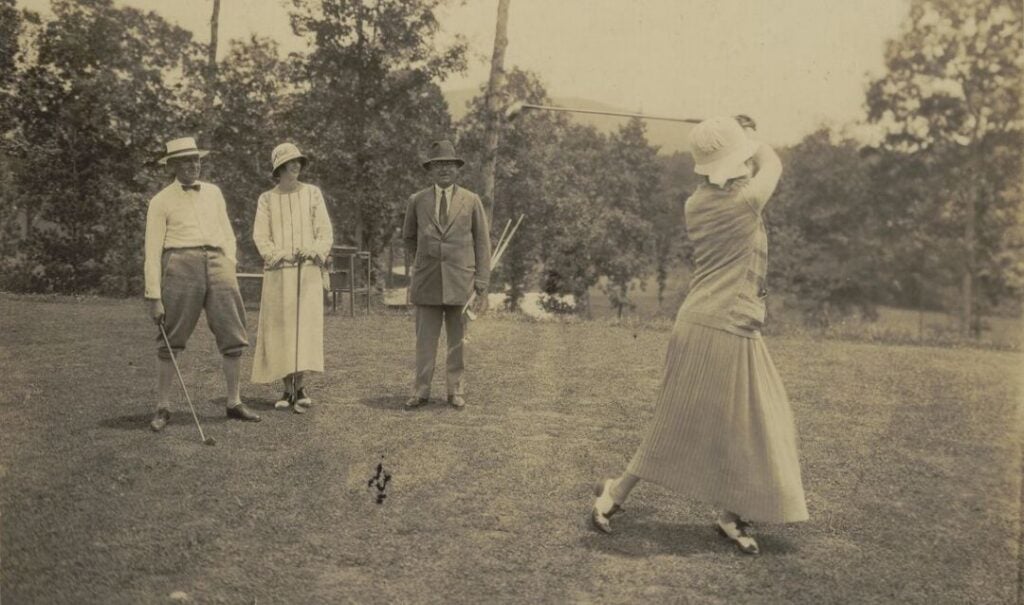 (L-R) Judge Junius Adams, Cornelia Vanderbilt, and Don Juan Riaño y Gayangos, first Spanish Ambassador to the US, watch as Edith Vanderbilt plays golf at Biltmore Forest Country Club on July 4, 1923.
