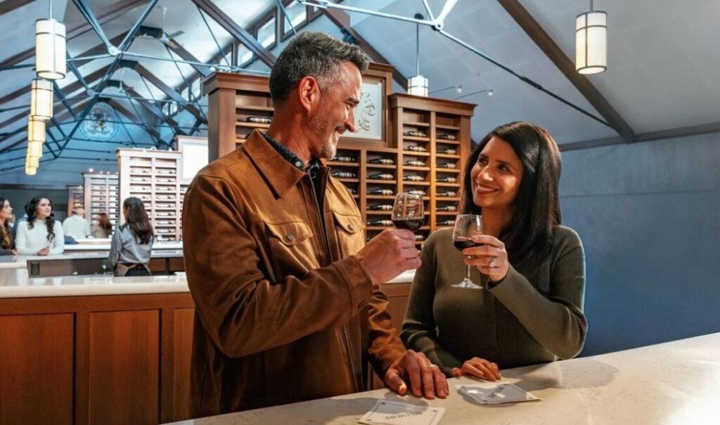 A couple enjoys a free wine tasting at Biltmore Estate Winery